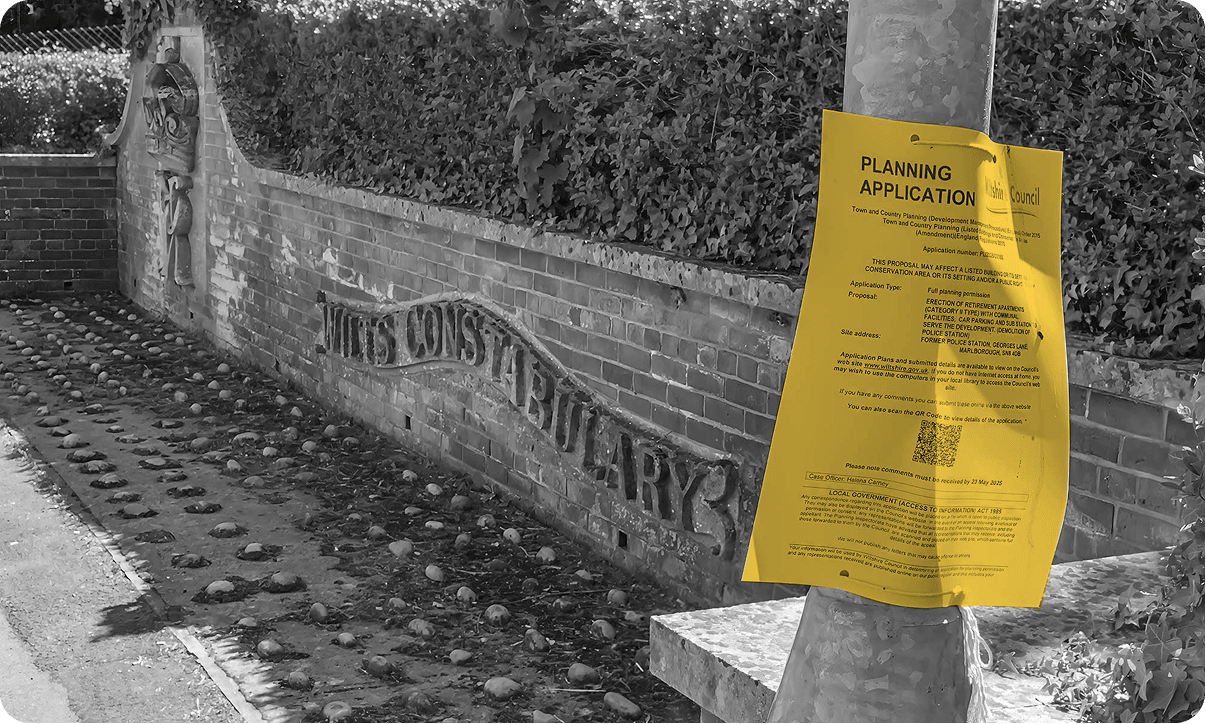 Traditional yellow planning application notice attached to a lamppost